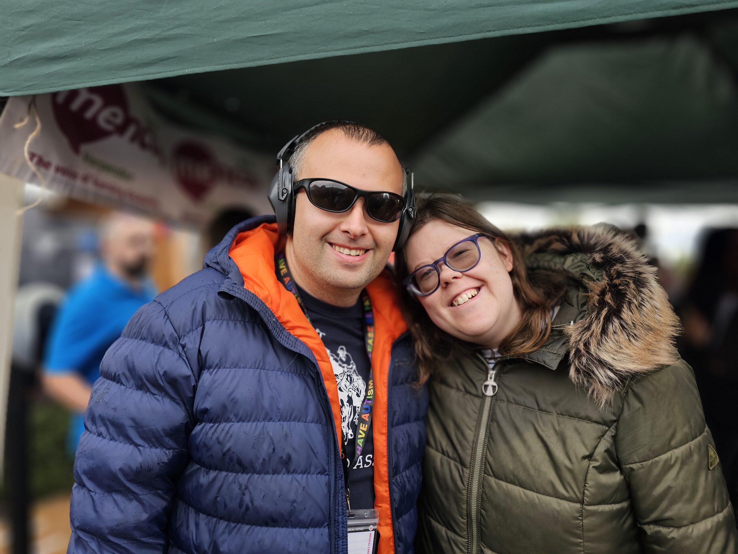 two members of our community smiling at the street party