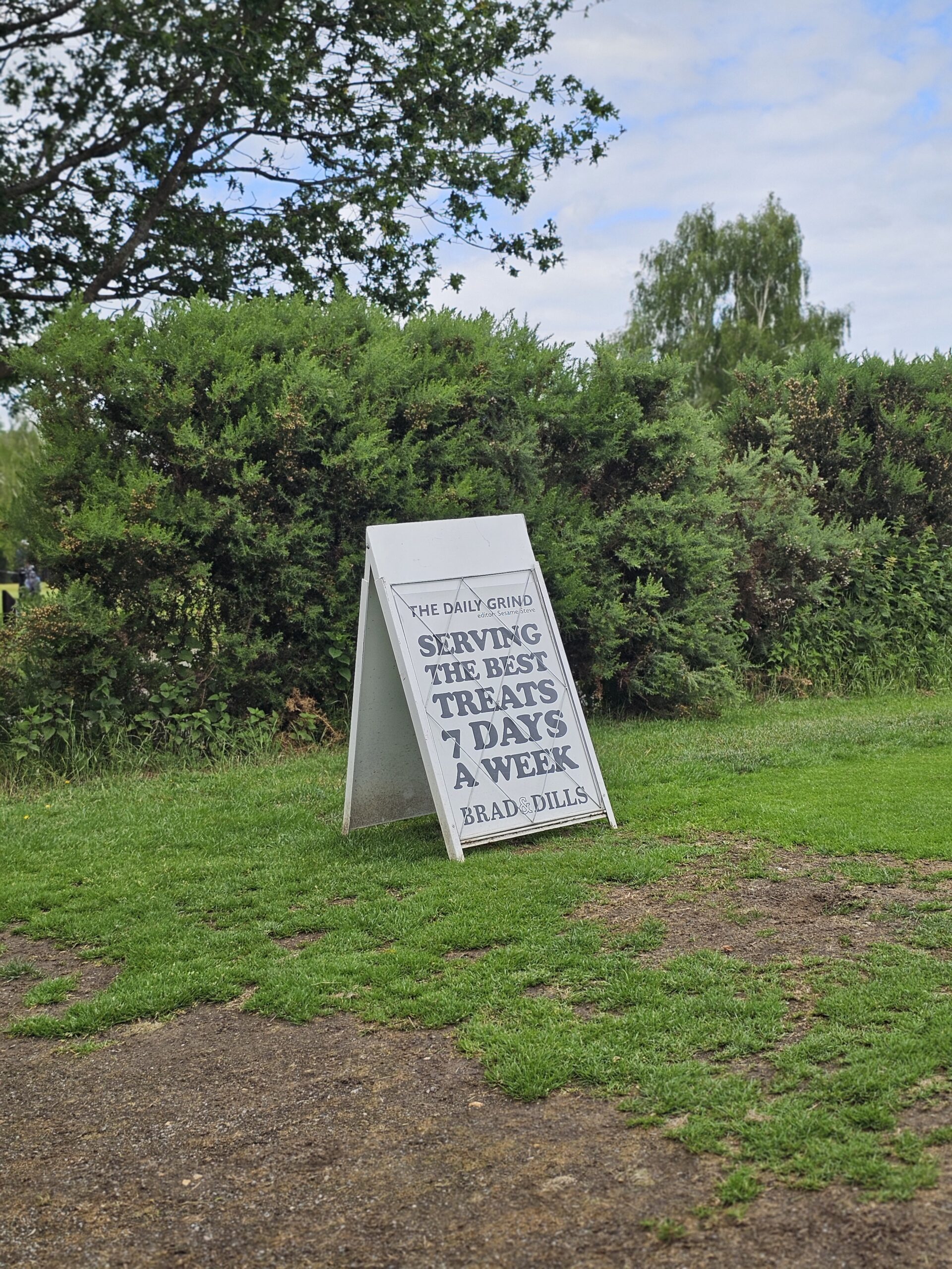 Brad & Dills' branded sandwich board on the hole